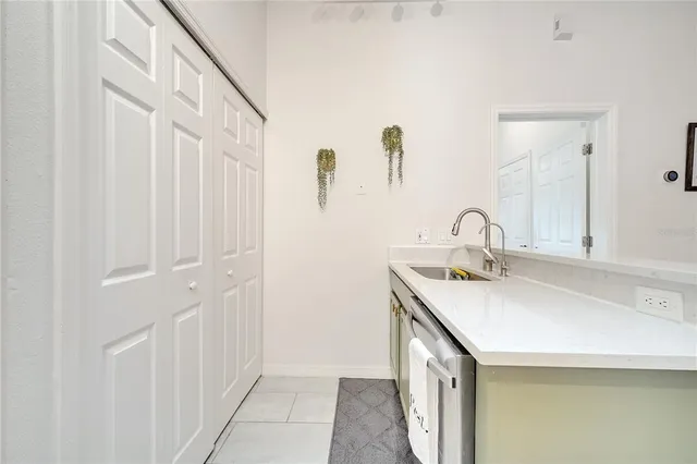 a view of a hallway with a livingroom and a bathroom