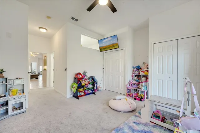 a bed room with a bed and a dresser