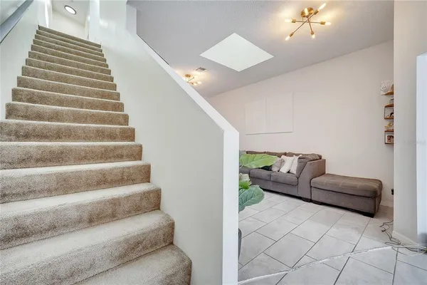 a bedroom with a bed and glass walk in closet