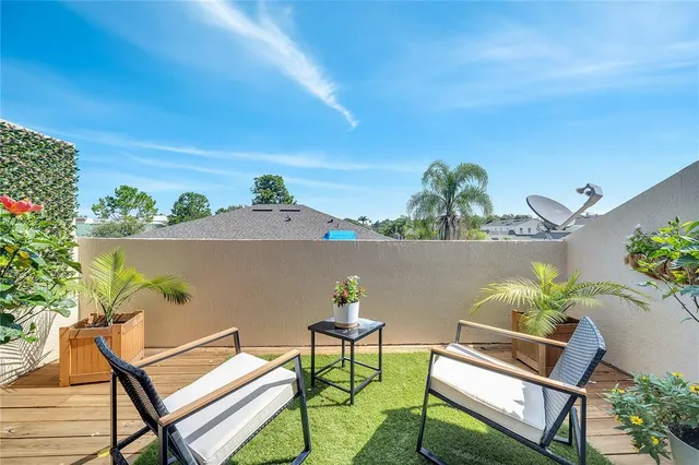 a view of a room with a white bed