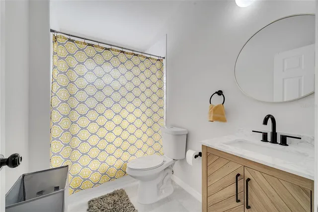 a view of a house with pool and chairs