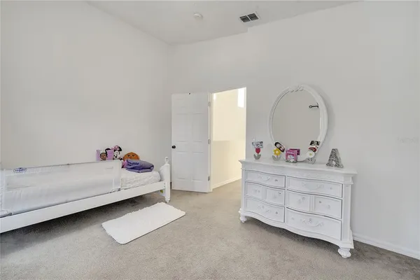 a front view of a house with swimming pool and glass windows