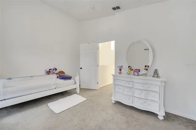 a front view of a house with swimming pool and glass windows