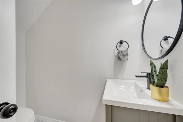 a kitchen with a sink appliances and cabinets