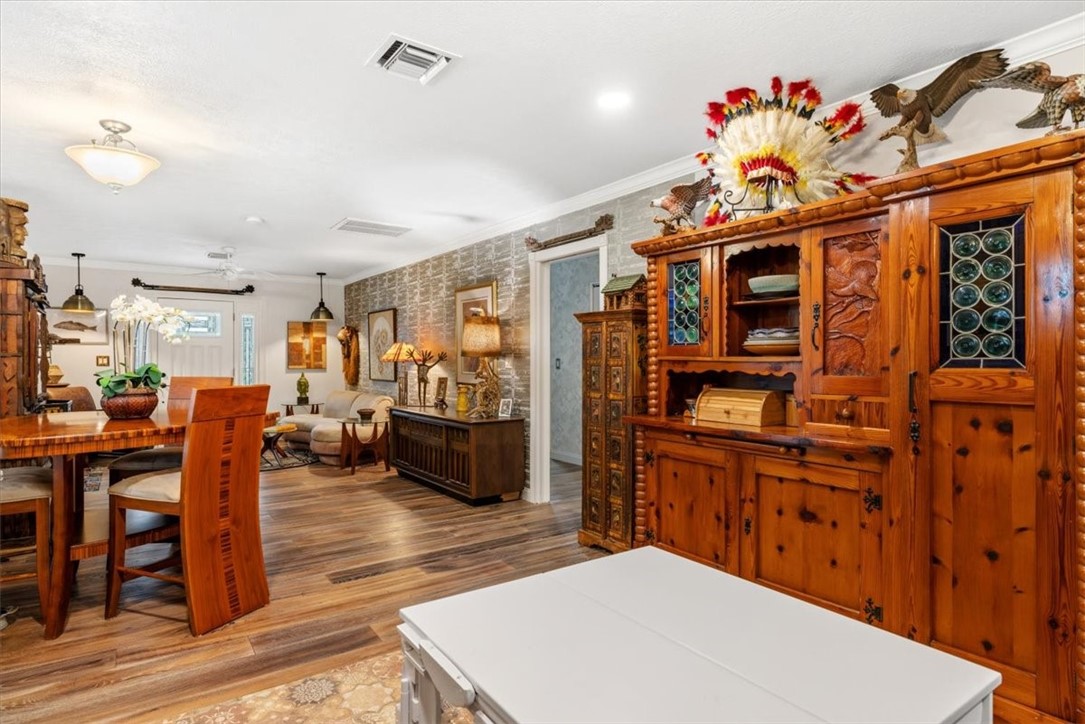 3496 3rd Place Vero Beach, FL 32968 - Photo 13 of 36 a living room with furniture a flat screen tv and a kitchen view