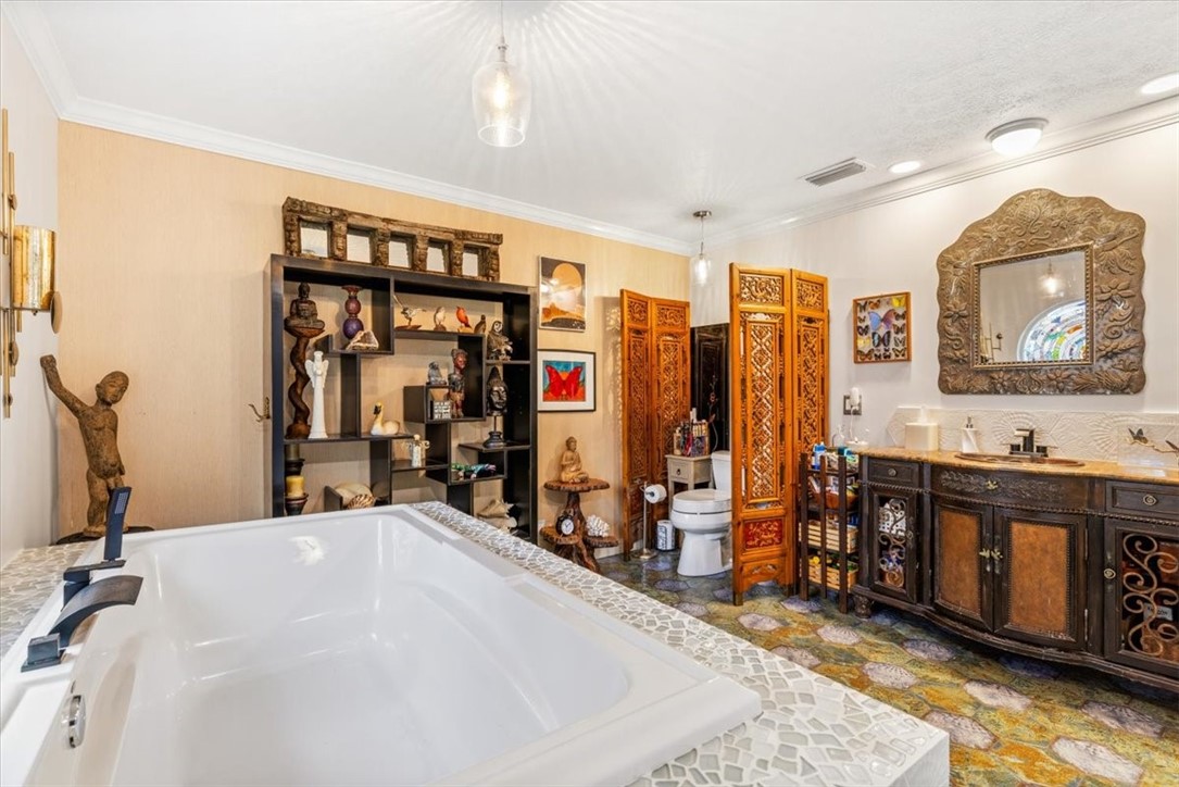 3496 3rd Place Vero Beach, FL 32968 - Photo 22 of 36 a very nice looking room with a large window and a mirror