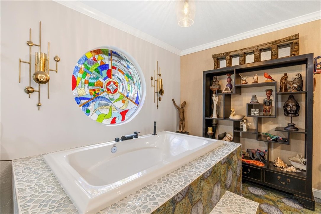 3496 3rd Place Vero Beach, FL 32968 - Photo 23 of 36 a bathroom with a sink a vanity and a window