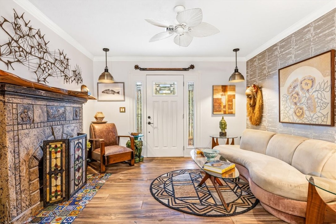 3496 3rd Place Vero Beach, FL 32968 - Photo 5 of 36 a living room with furniture a fireplace and a chandelier