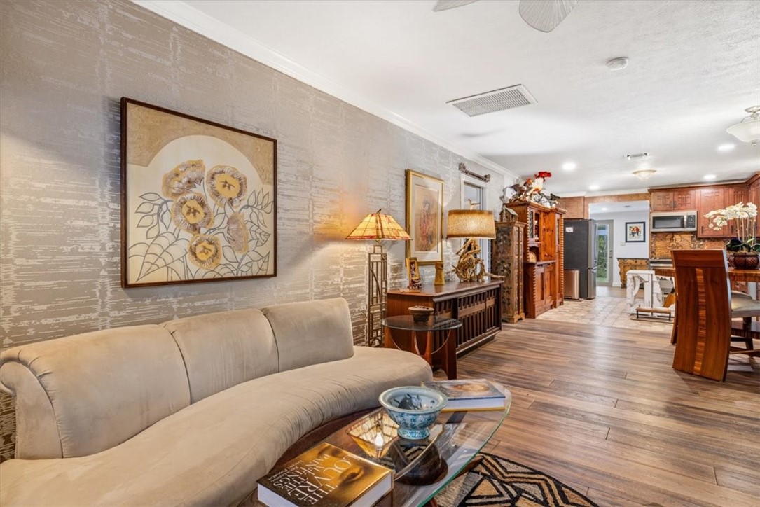3496 3rd Place Vero Beach, FL 32968 - Photo 7 of 36 a living room with furniture and wooden floor