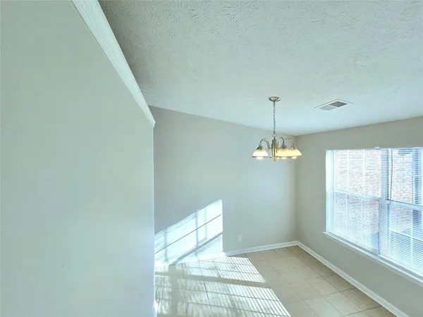 a view of a livingroom with a chandelier fan