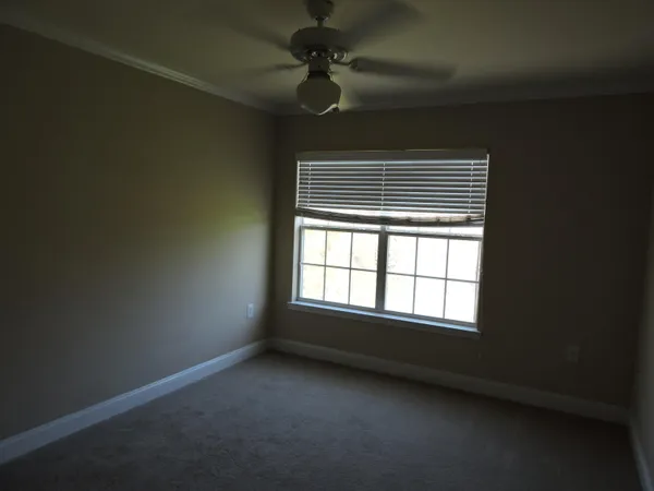 a view of a hallway with a room