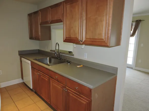 a kitchen with a sink and cabinets