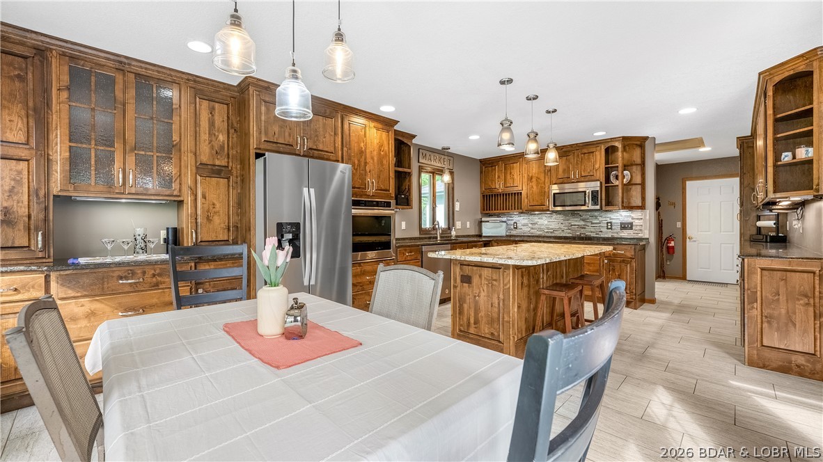 490 Waterfowl Road Linn Creek, MO 65052 - Photo 12 of 52 Dining to Kitchen View