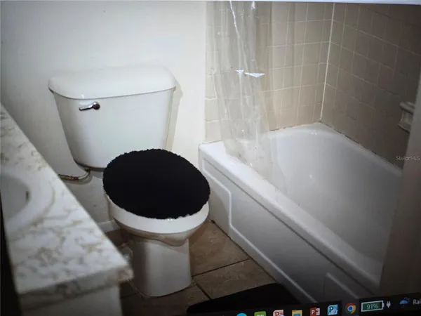 a bathroom with a toilet and a sink