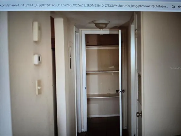 a kitchen with a refrigerator and a sink