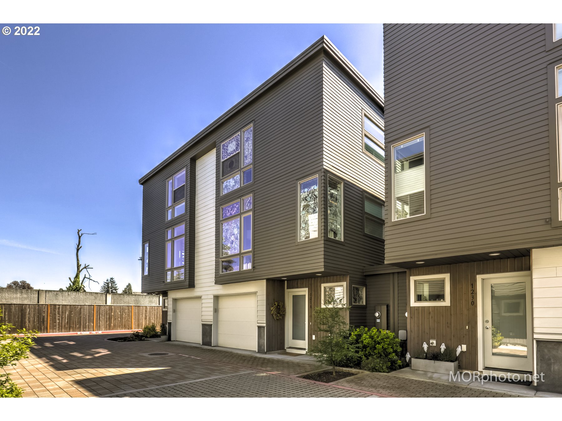 1208 North Morgan Street Portland, OR 97217 - Photo 1 of 23 a front view of a house with a yard