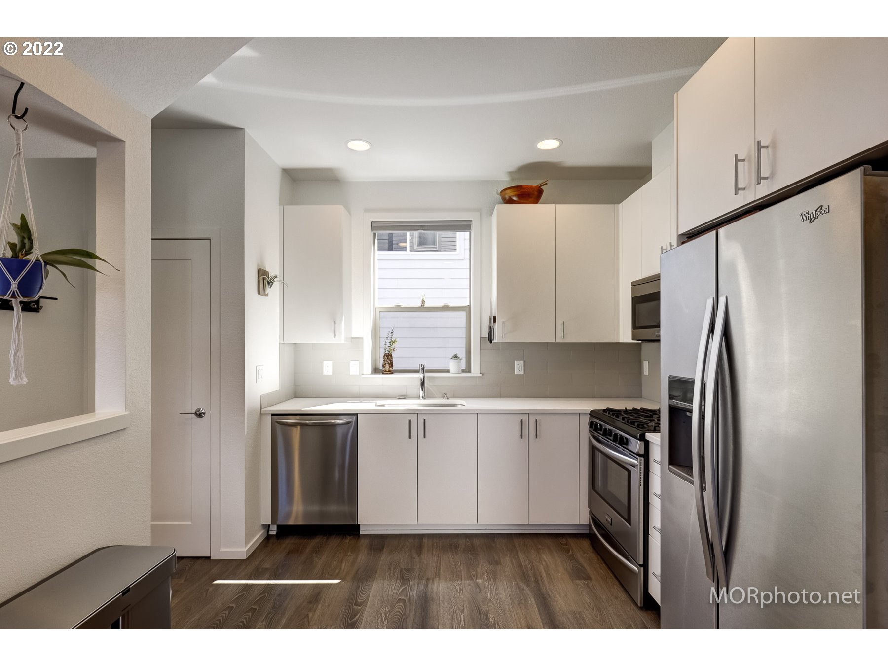 1208 North Morgan Street Portland, OR 97217 - Photo 13 of 23 a kitchen with stainless steel appliances a refrigerator sink and microwave