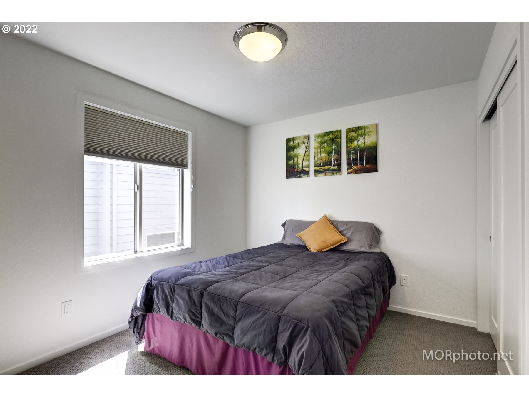 1208 North Morgan Street Portland, OR 97217 - Photo 17 of 23 a bedroom with a bed and a window