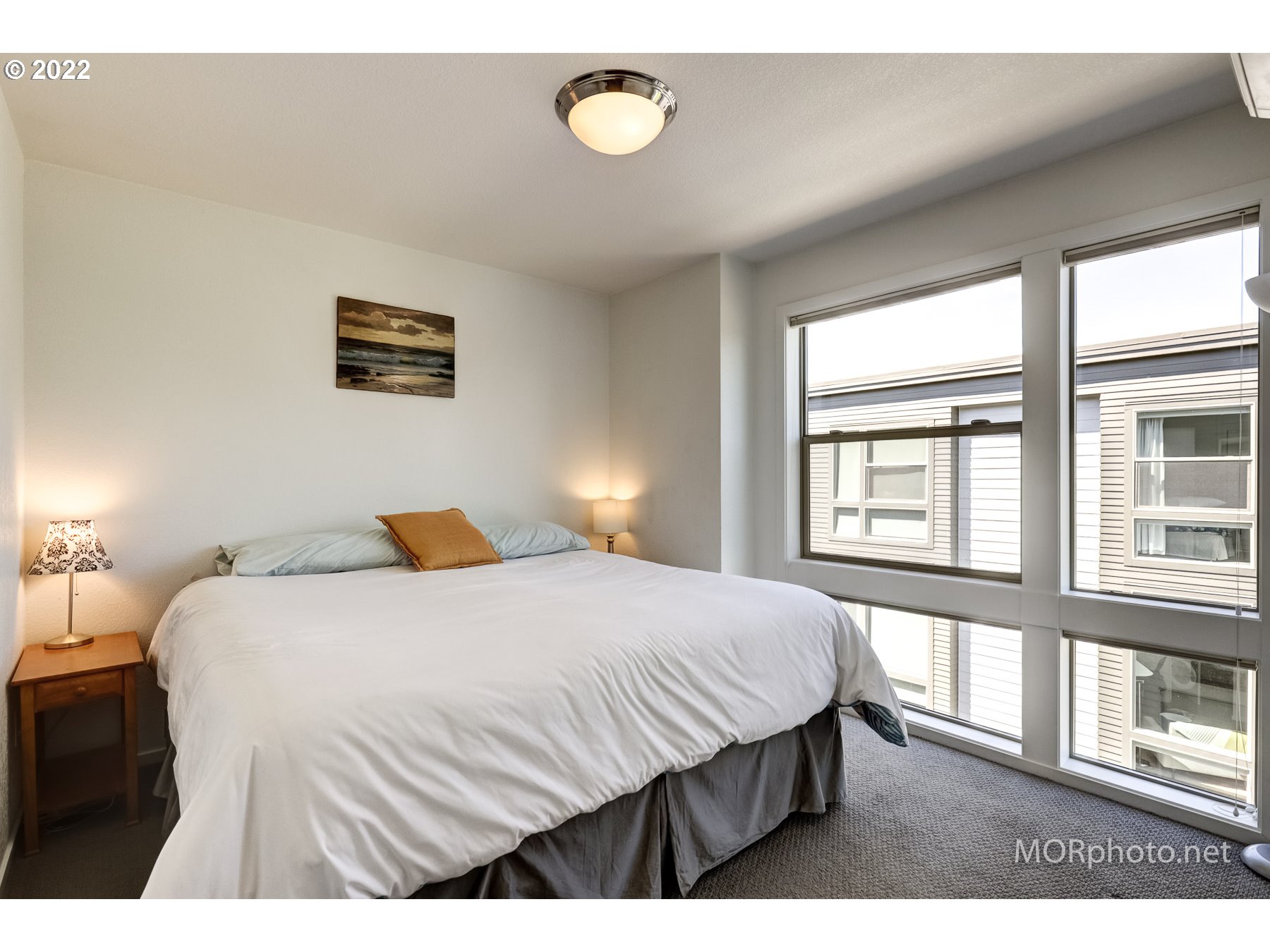 1208 North Morgan Street Portland, OR 97217 - Photo 19 of 23 a bedroom with a bed and a window
