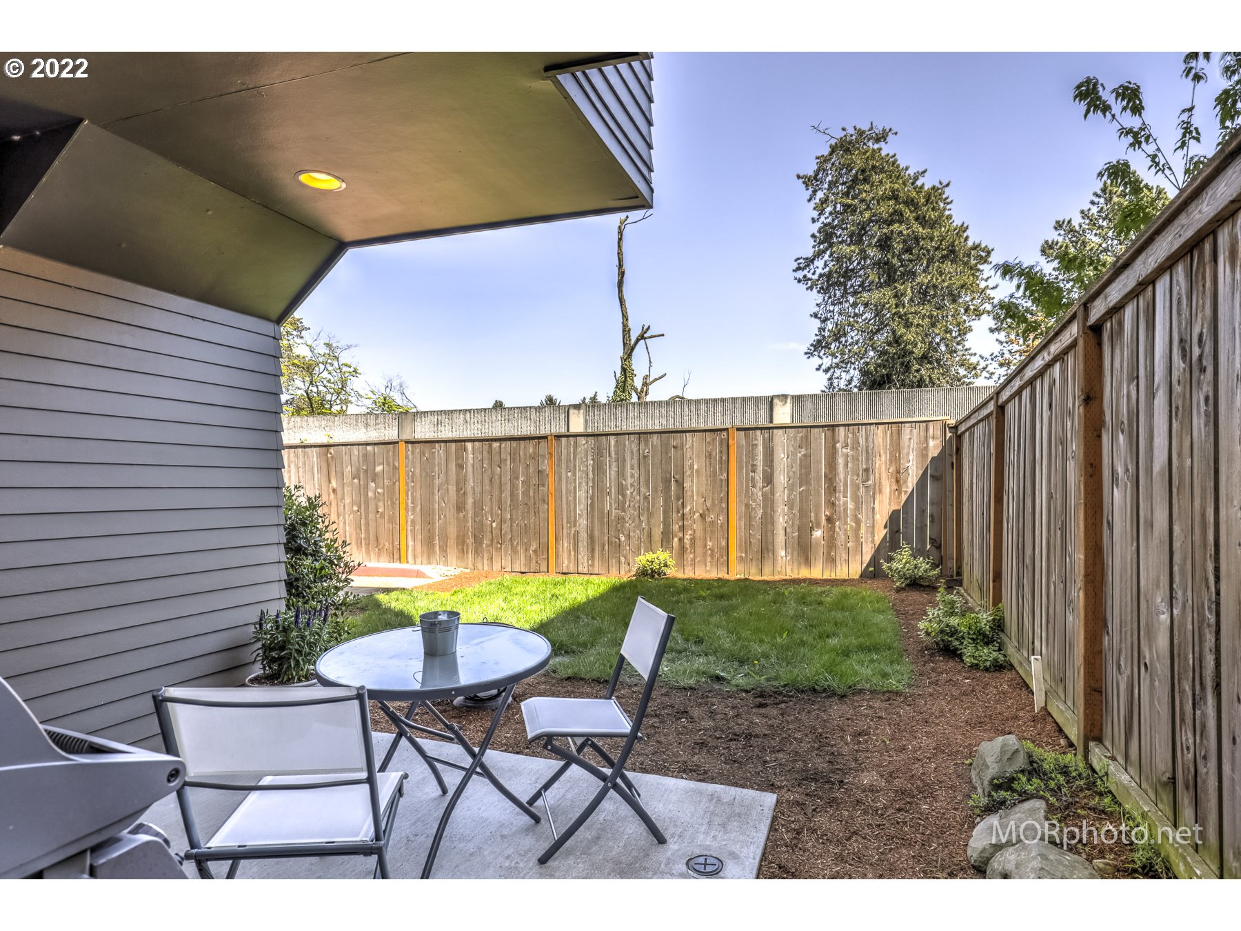 1208 North Morgan Street Portland, OR 97217 - Photo 21 of 23 a view of a chairs and table in patio with wooden fence