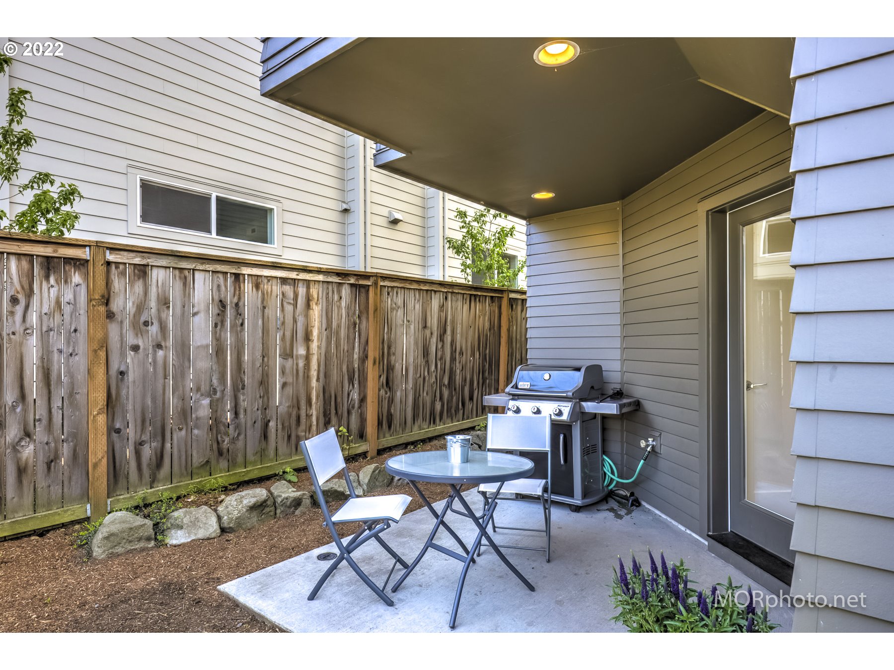 1208 North Morgan Street Portland, OR 97217 - Photo 22 of 23 a backyard of a house with table and chairs