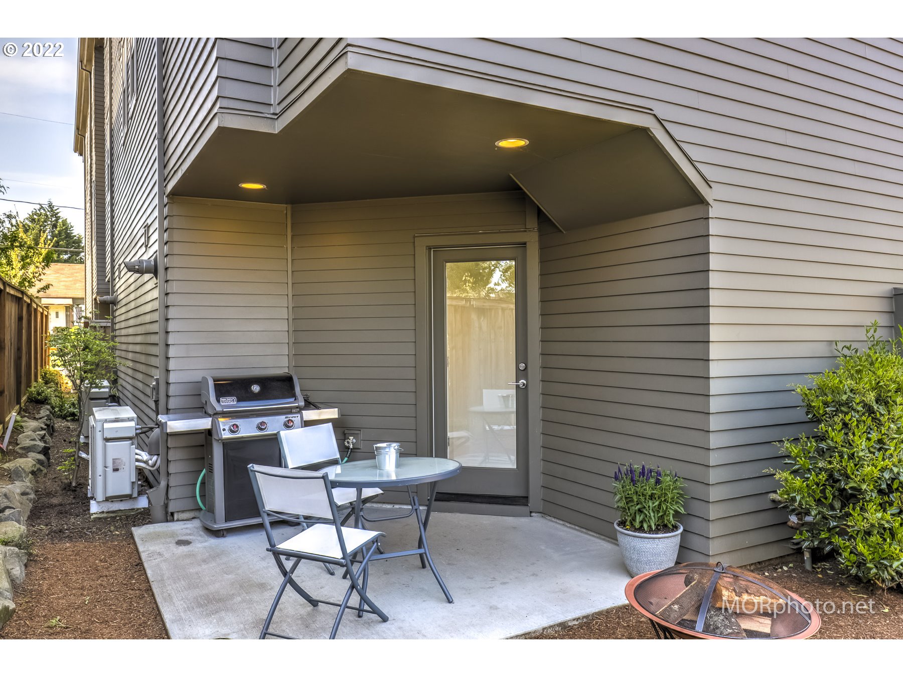 1208 North Morgan Street Portland, OR 97217 - Photo 23 of 23 a patio with table and chairs and potted plants
