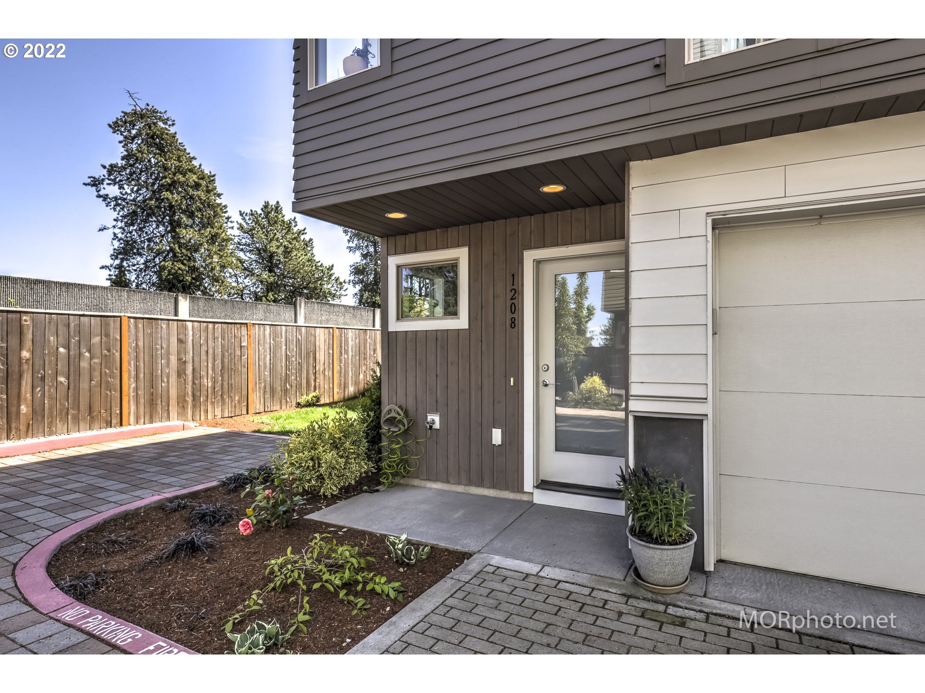 1208 North Morgan Street Portland, OR 97217 - Photo 3 of 23 a backyard of a house with table and chairs