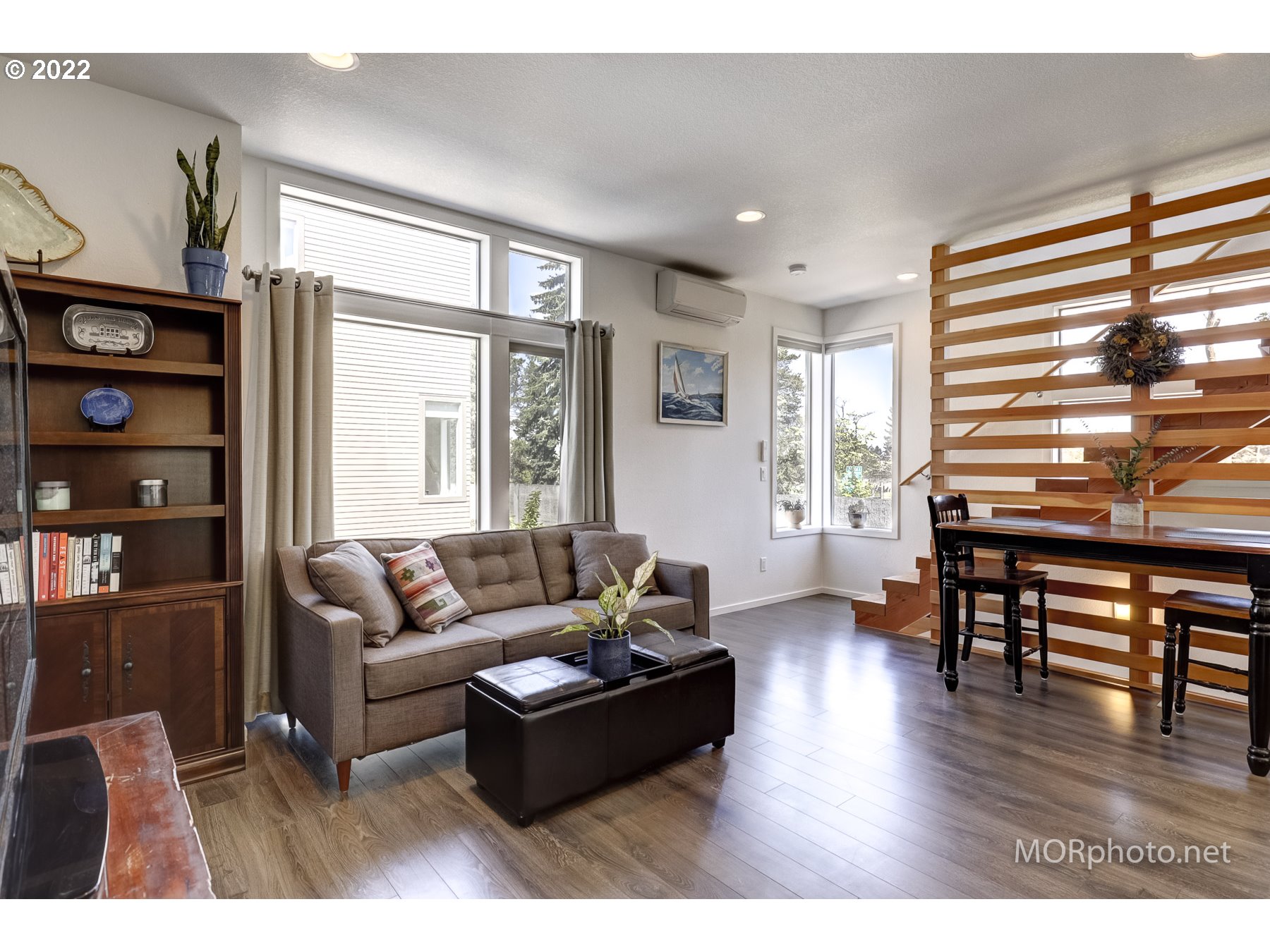 1208 North Morgan Street Portland, OR 97217 - Photo 5 of 23 a living room with furniture a wooden floor and a window