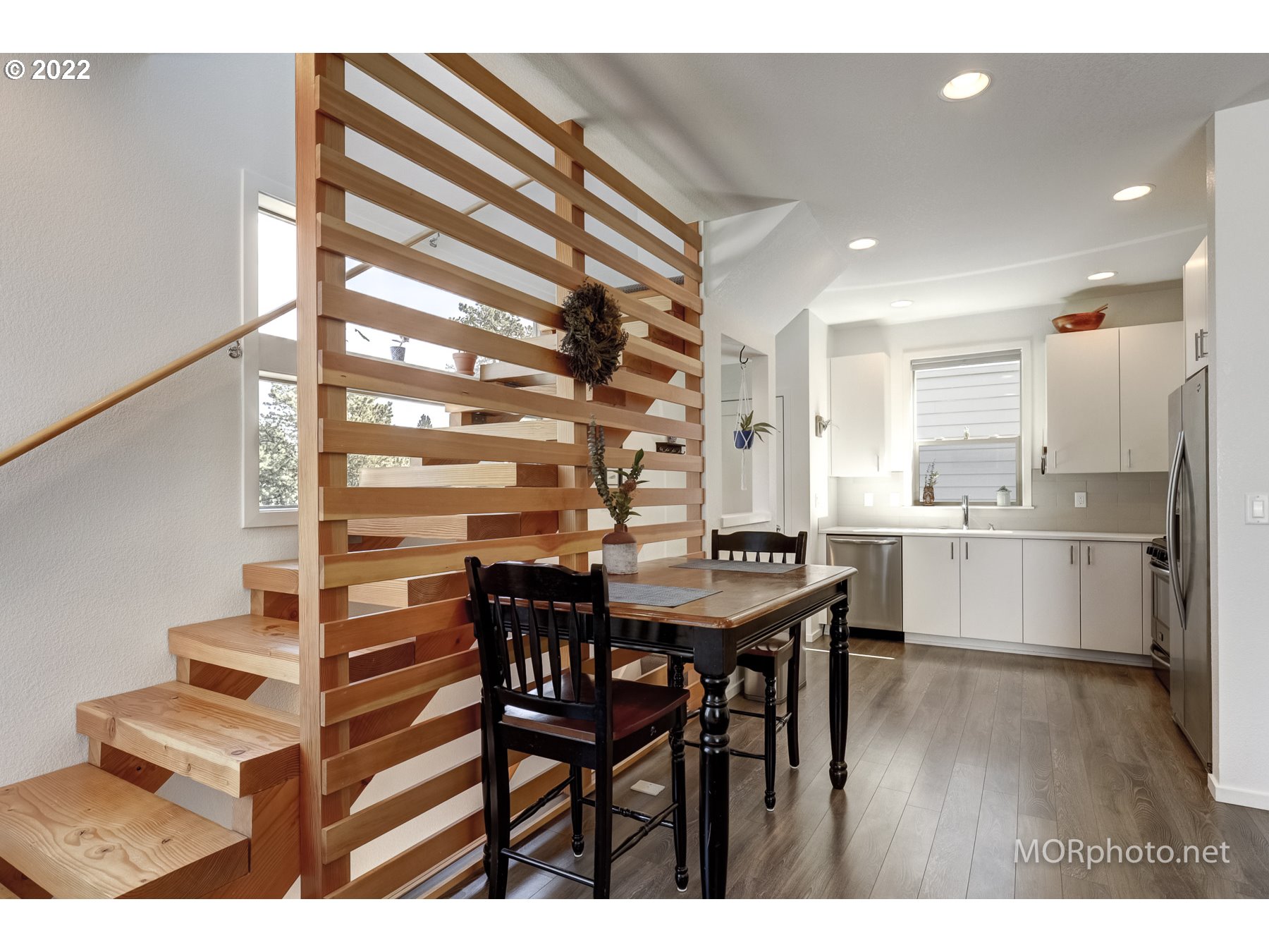 1208 North Morgan Street Portland, OR 97217 - Photo 7 of 23 a view of a dining room with furniture and wooden floor