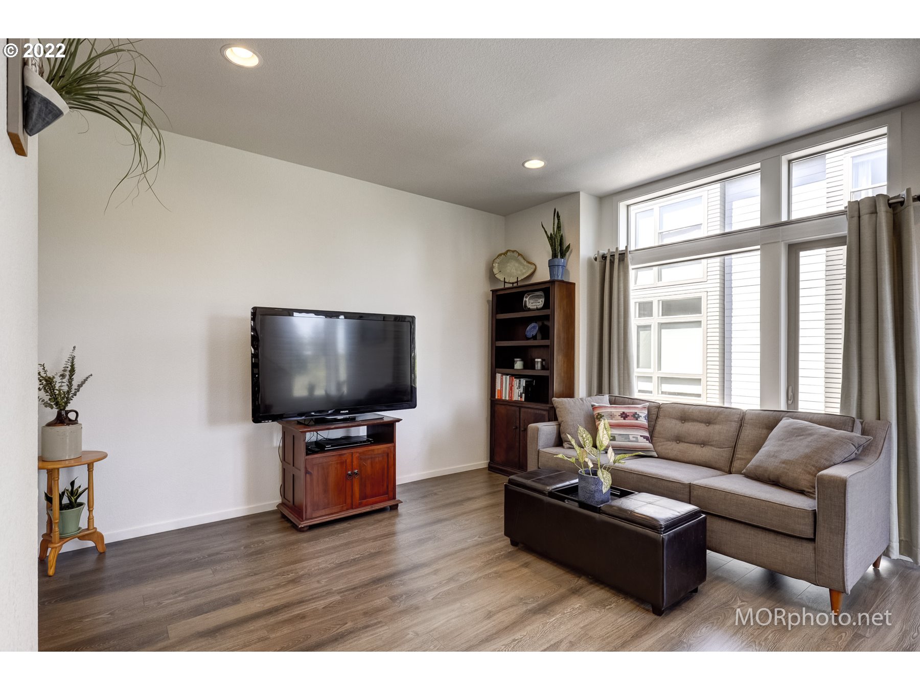 1208 North Morgan Street Portland, OR 97217 - Photo 9 of 23 a living room with furniture and a flat screen tv
