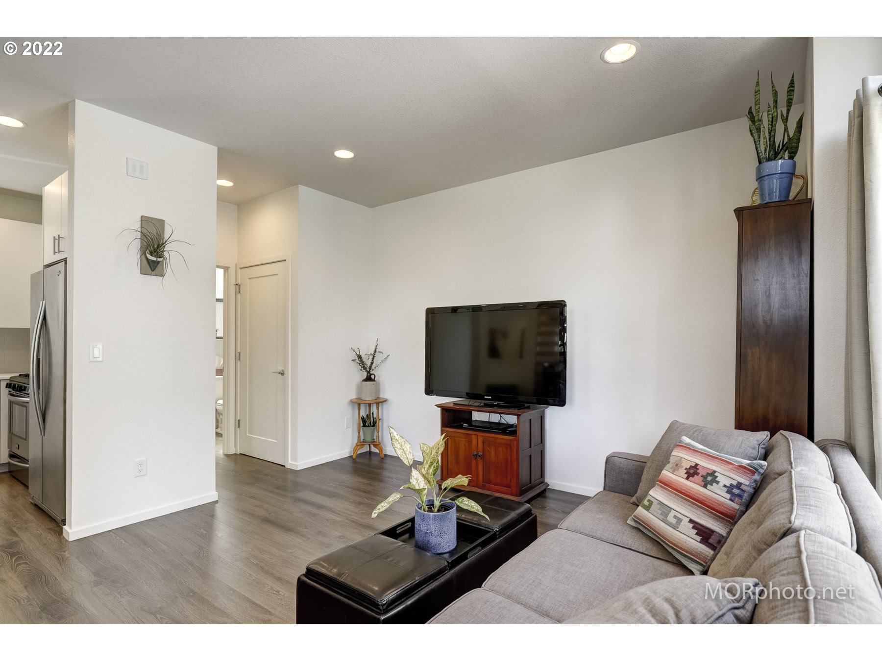 1208 North Morgan Street Portland, OR 97217 - Photo 10 of 23 a living room with furniture and a flat screen tv