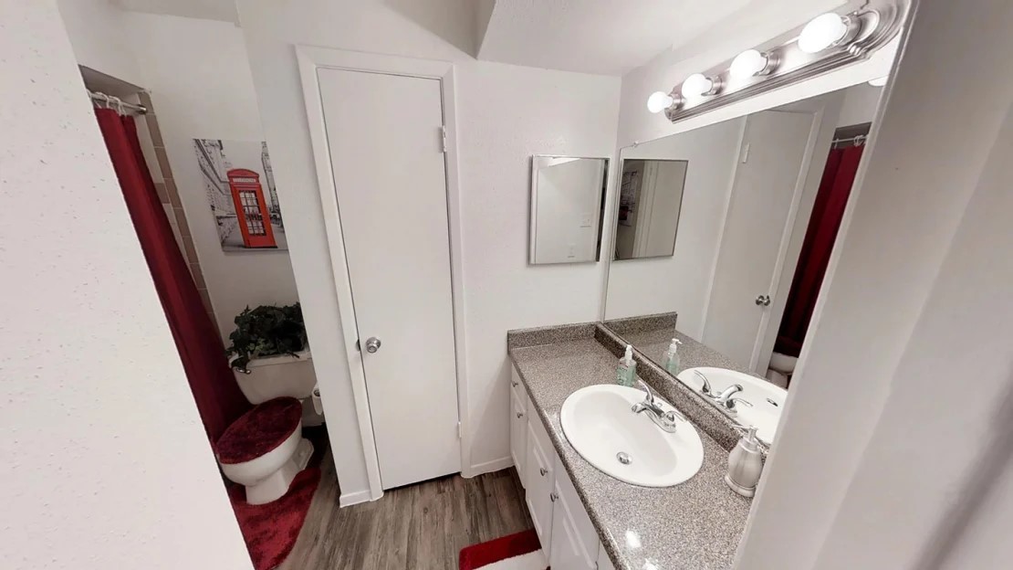 515 South Bender Avenue, Unit 501 Humble, TX 77338 - Photo 2 of 17 a bathroom with a sink and a mirror