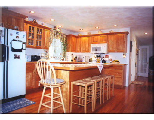 7 Deer Haven Road Beverly, MA 01915 - Photo 8 of 14 a dining room with furniture a kitchen view and a window