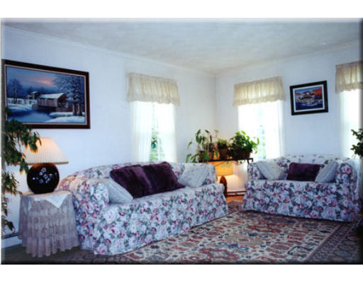7 Deer Haven Road Beverly, MA 01915 - Photo 9 of 14 a living room with furniture and a painting