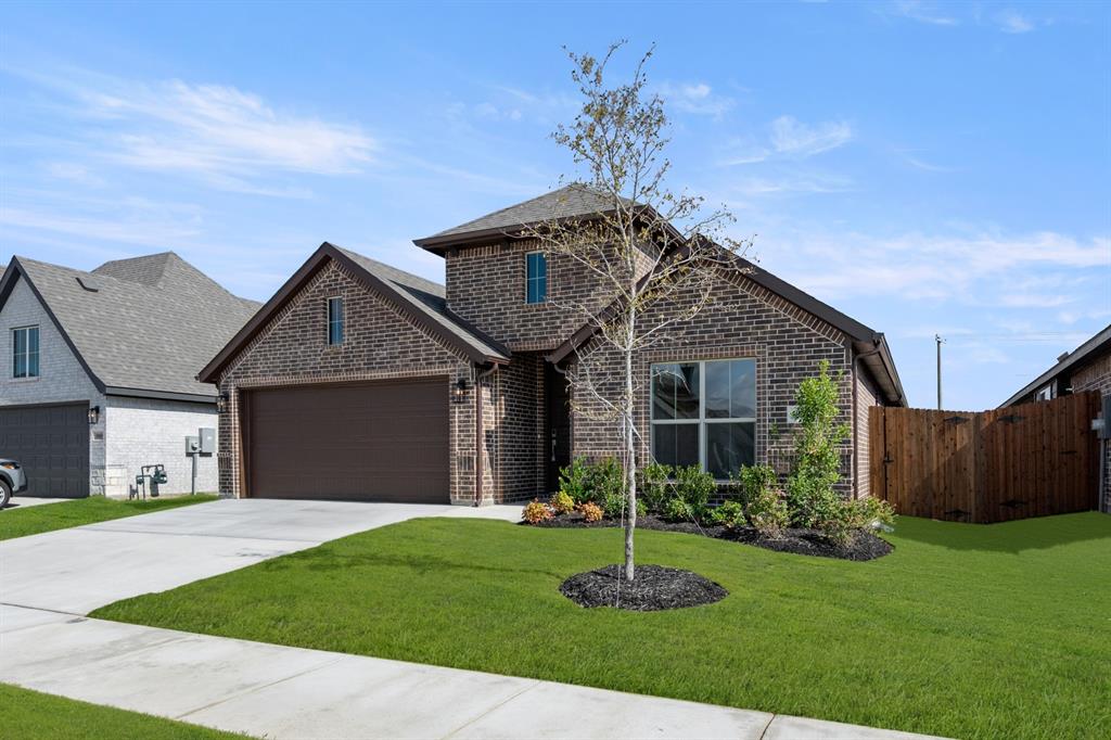 10809 Rothland Street Crowley, TX 76036 - Photo 27 of 30 a front view of a house with a garden