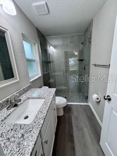 20193 Southwest 83rd Street Dunnellon, FL 34431 - Photo 13 of 31 a bathroom with a granite countertop sink a toilet a mirror and shower