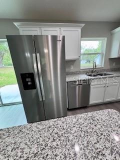 20193 Southwest 83rd Street Dunnellon, FL 34431 - Photo 17 of 31 a kitchen with stainless steel appliances a refrigerator and a sink