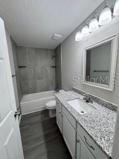 20193 Southwest 83rd Street Dunnellon, FL 34431 - Photo 22 of 31 a bathroom with a granite countertop double vanity sink and mirror with bathtub