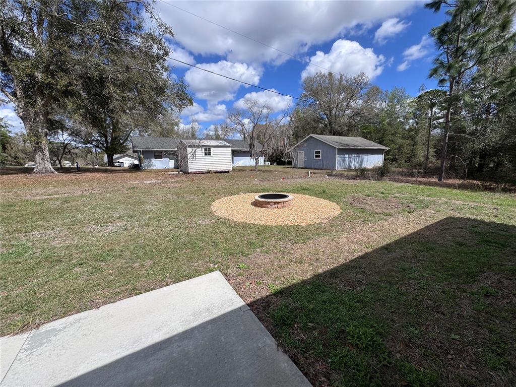20193 Southwest 83rd Street Dunnellon, FL 34431 - Photo 31 of 31 a front view of a house with a yard and a large tree