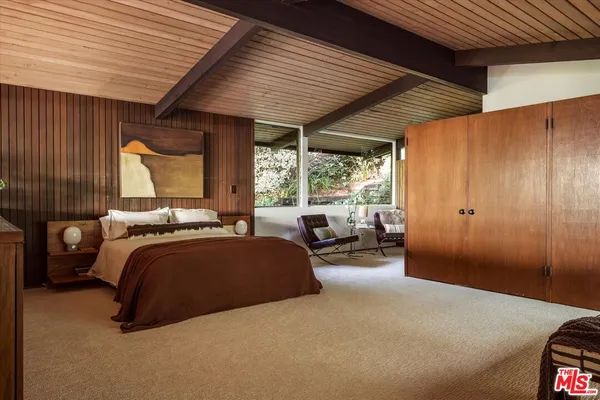 a bed room with a bed and a couch