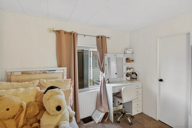 a bathroom with a sink mirror and a bathtub