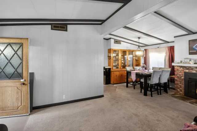 a view of a livingroom with furniture and a window