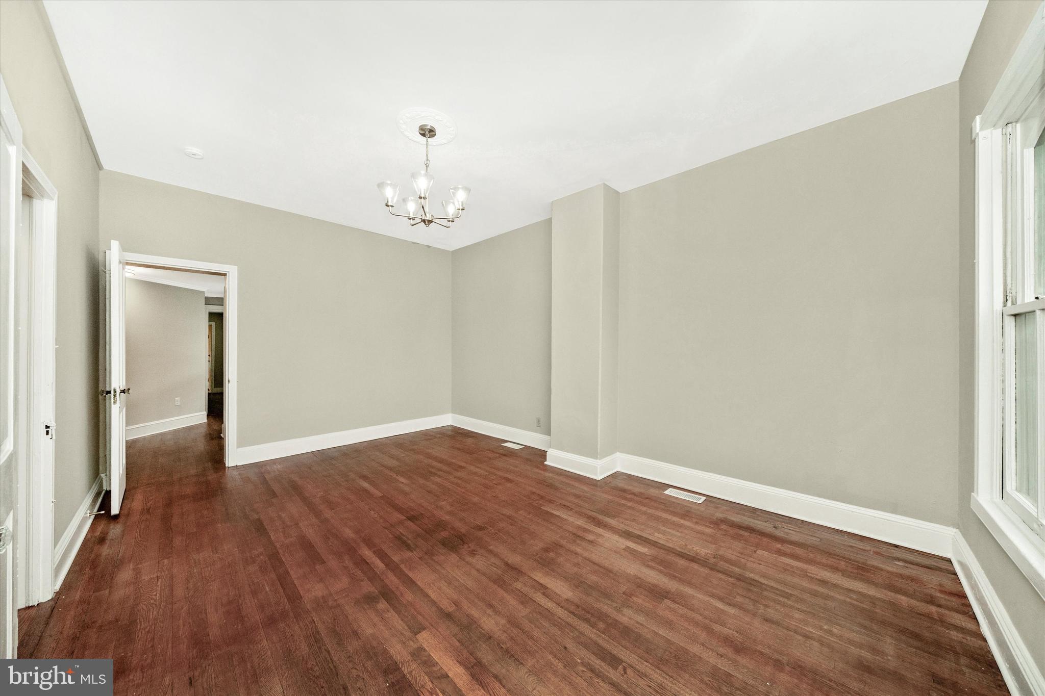 129 West 4th Street Frederick, MD 21701 - Photo 40 of 70 wooden floor in an empty room with a window