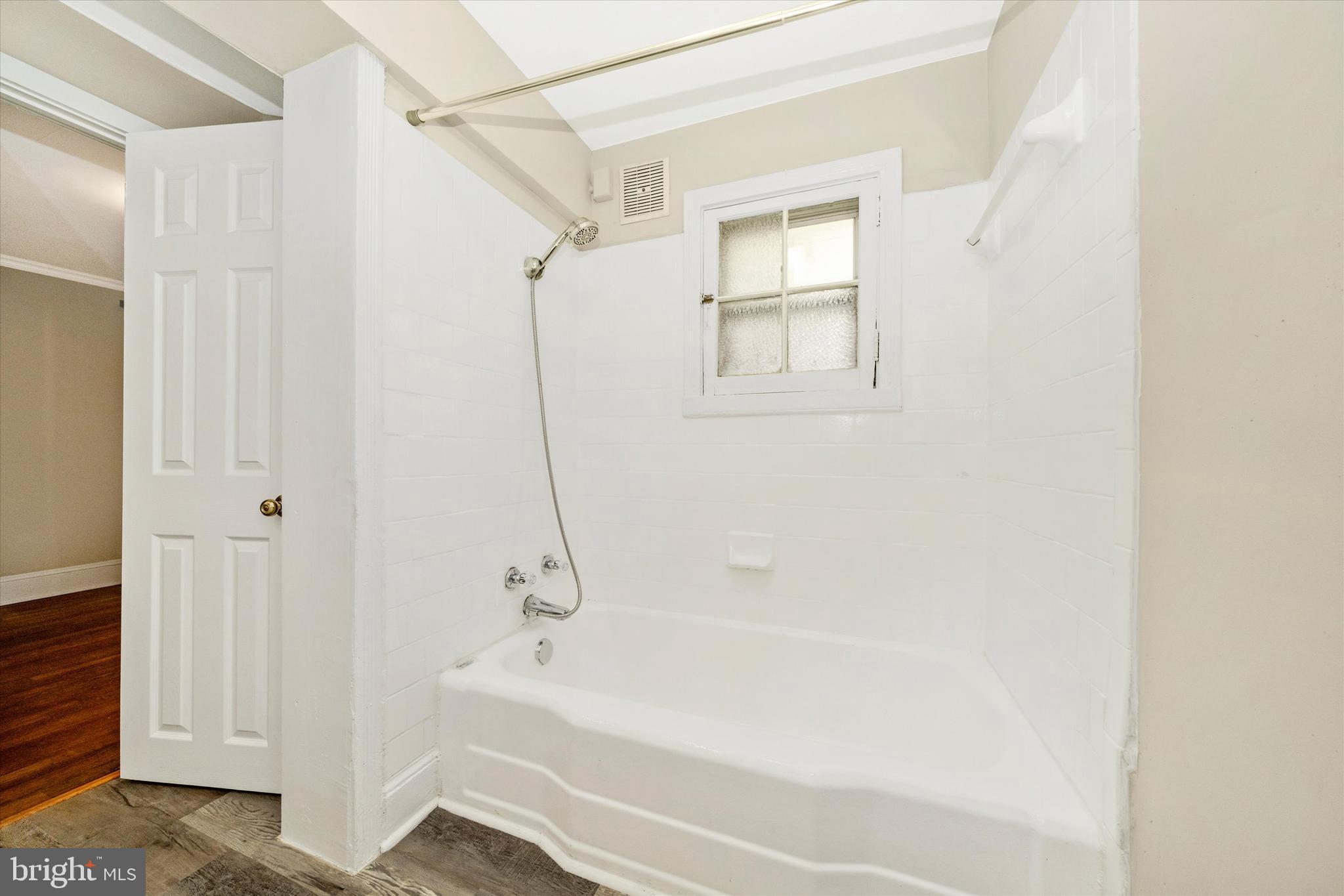 129 West 4th Street Frederick, MD 21701 - Photo 42 of 70 a bathroom with a bathtub and a shower