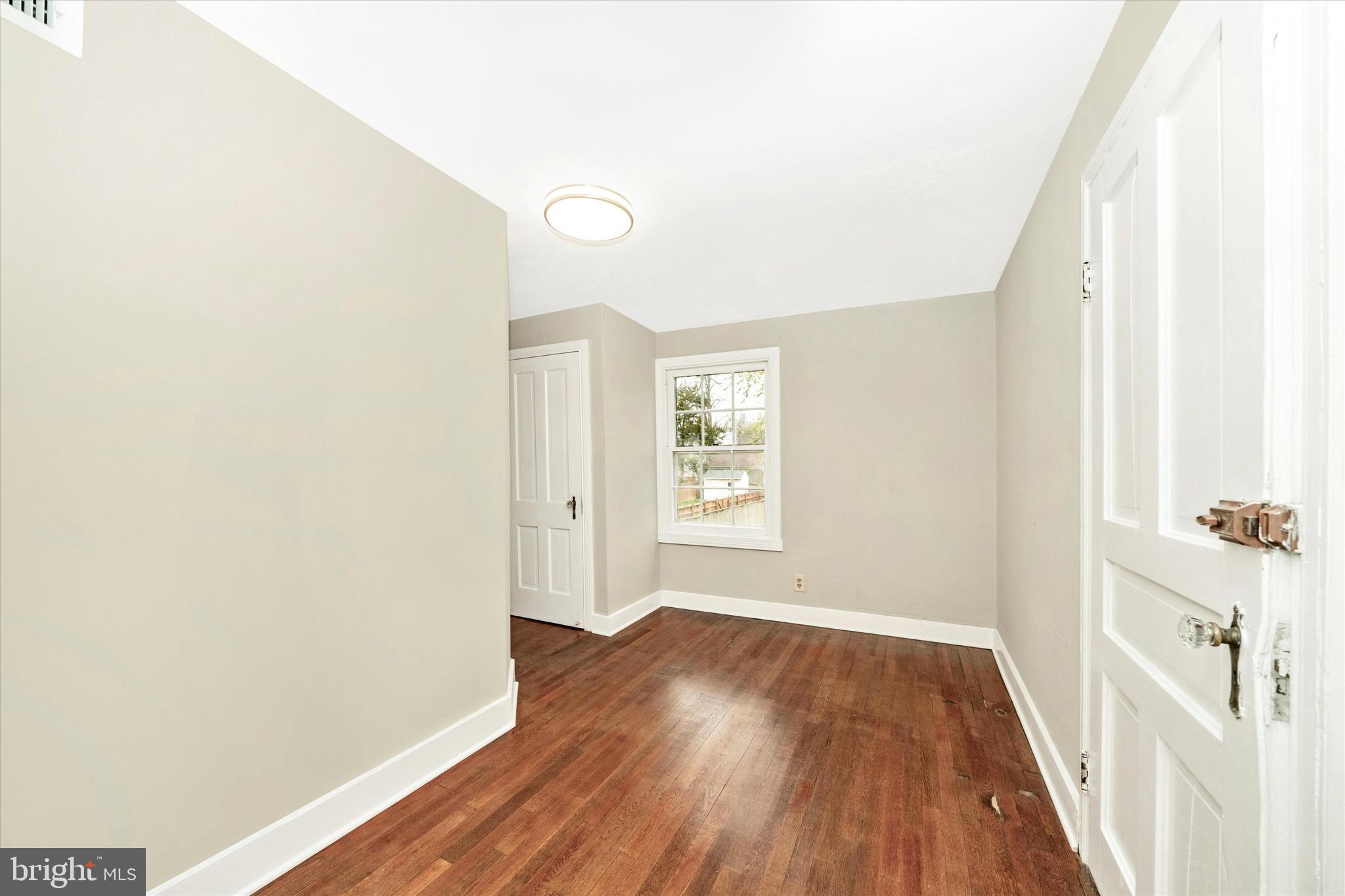 129 West 4th Street Frederick, MD 21701 - Photo 43 of 70 a view of a room with wooden floor and windows