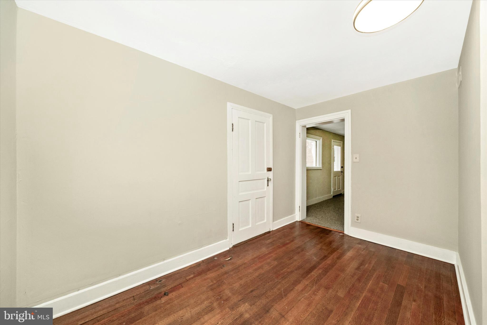 129 West 4th Street Frederick, MD 21701 - Photo 46 of 70 a view of an empty room with wooden floor and closet