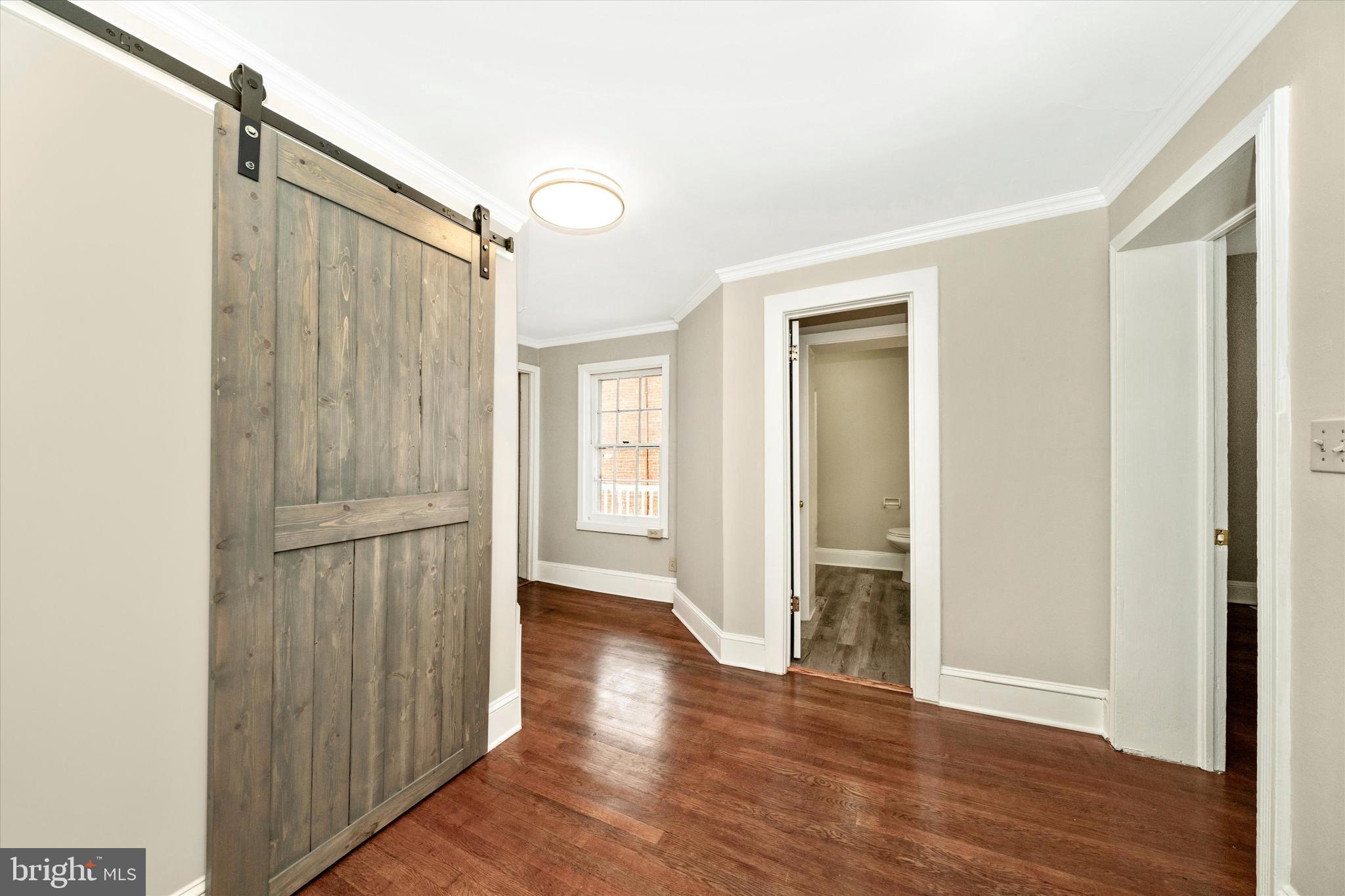 129 West 4th Street Frederick, MD 21701 - Photo 47 of 70 a view of a hallway with wooden floor