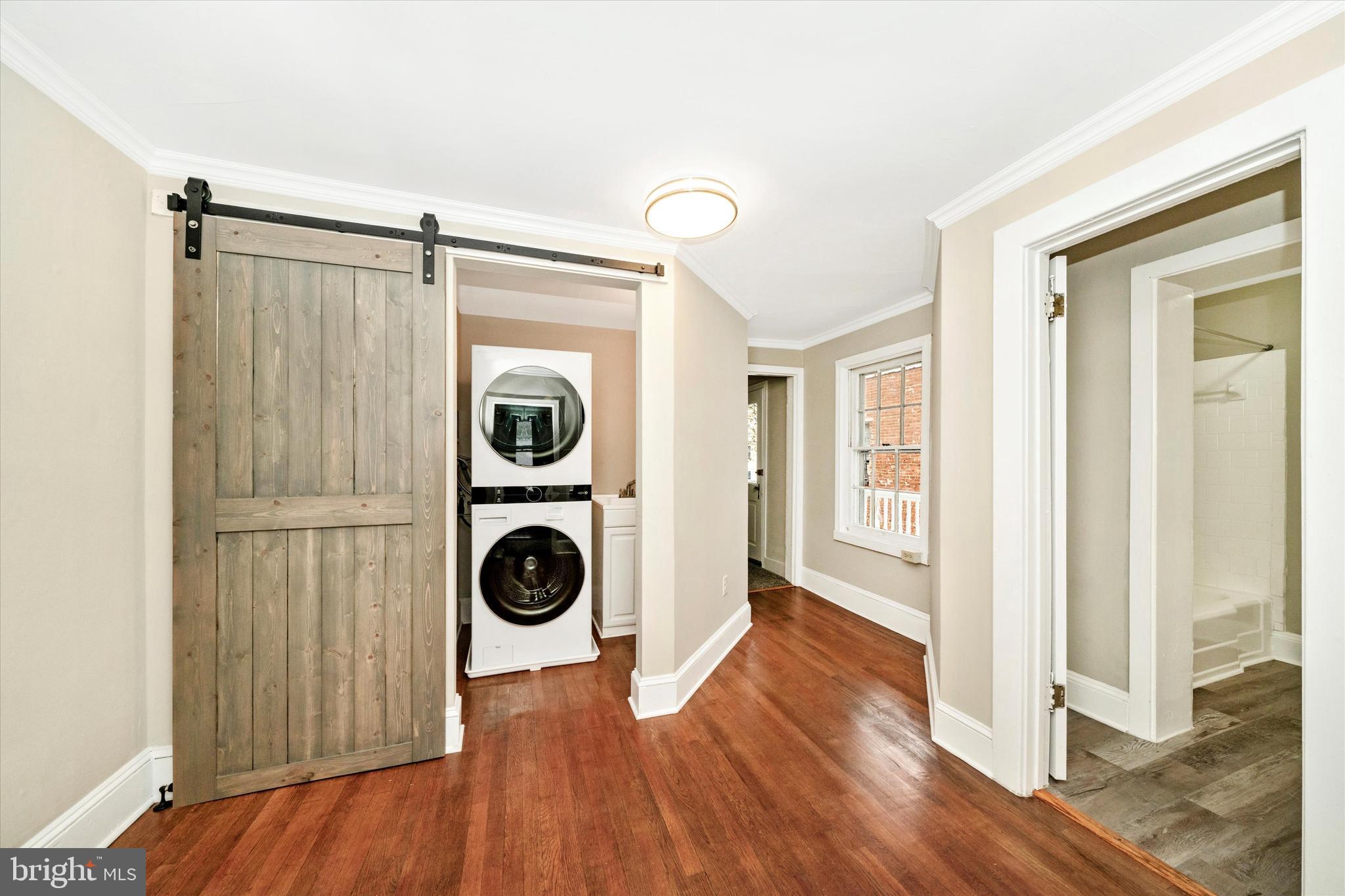 129 West 4th Street Frederick, MD 21701 - Photo 49 of 70 a view of a hallway with washer and dryer