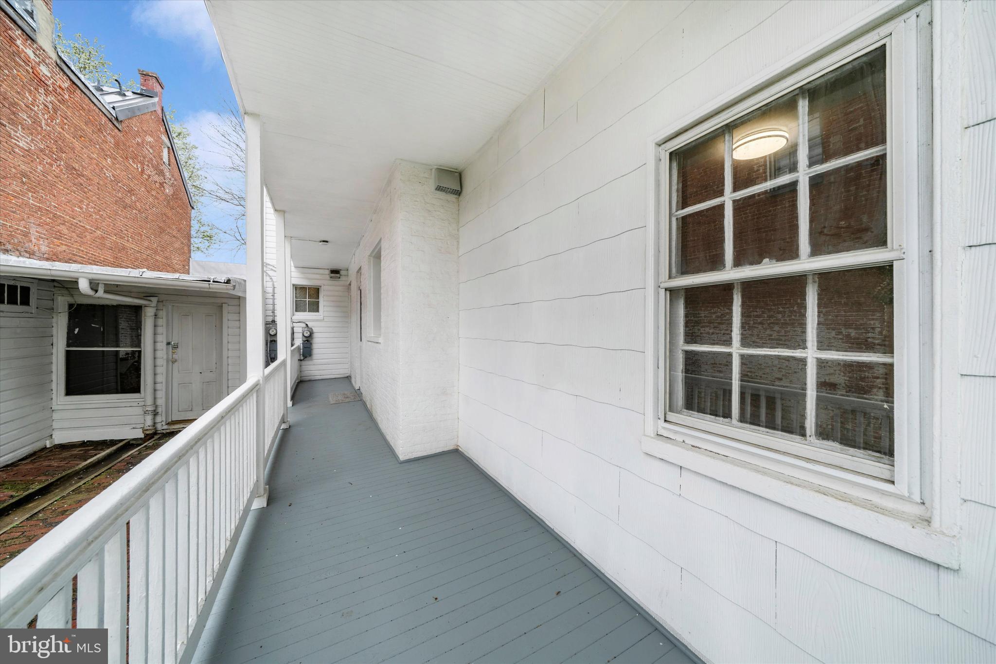 129 West 4th Street Frederick, MD 21701 - Photo 55 of 70 a view of balcony with wooden floor and stairs