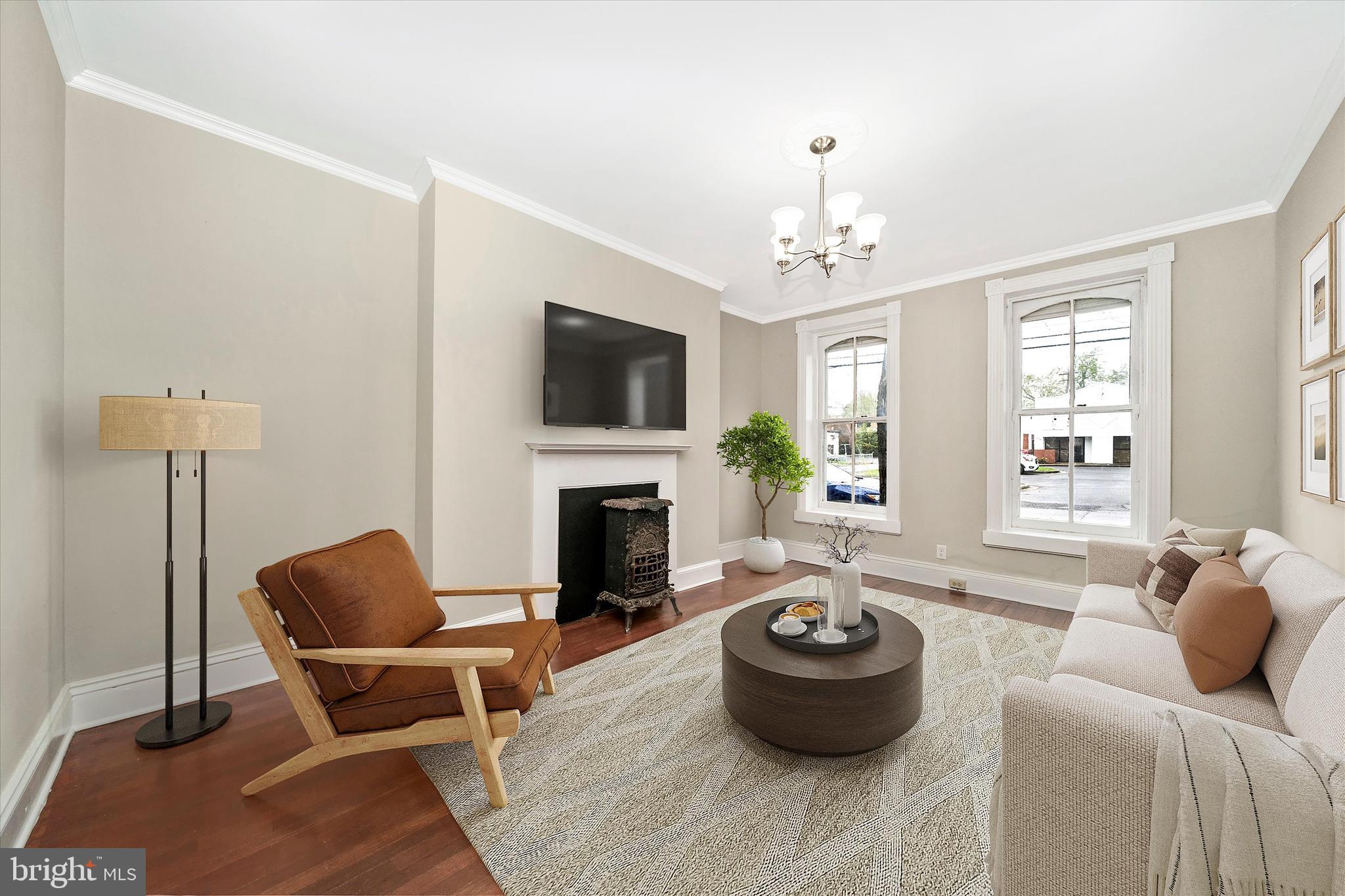 129 West 4th Street Frederick, MD 21701 - Photo 8 of 70 a living room with furniture a window and a fireplace